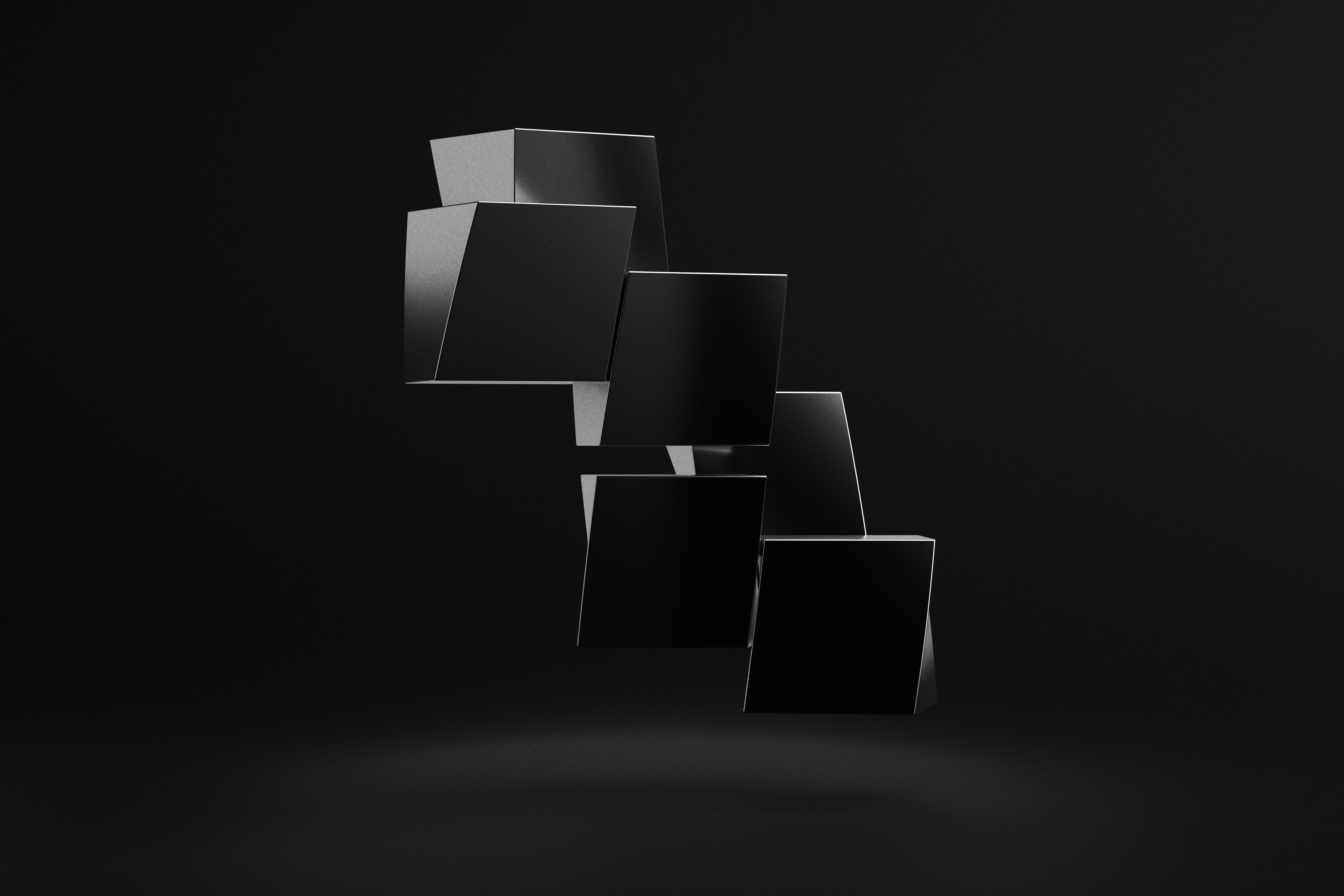 A black and white photo of cubes on a black background