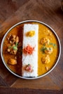 A bowl of food on a wooden table