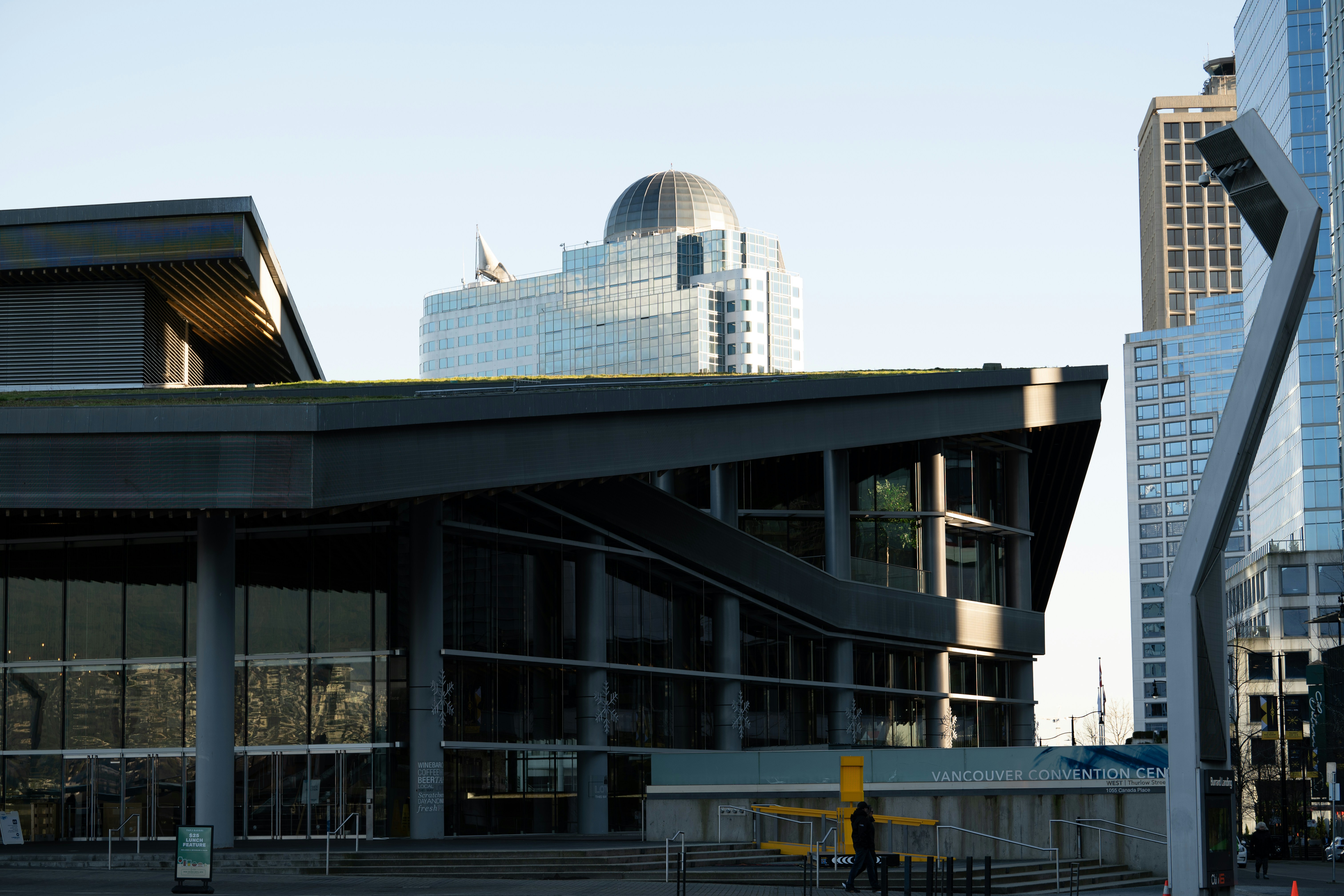 A city street with tall buildings in the background