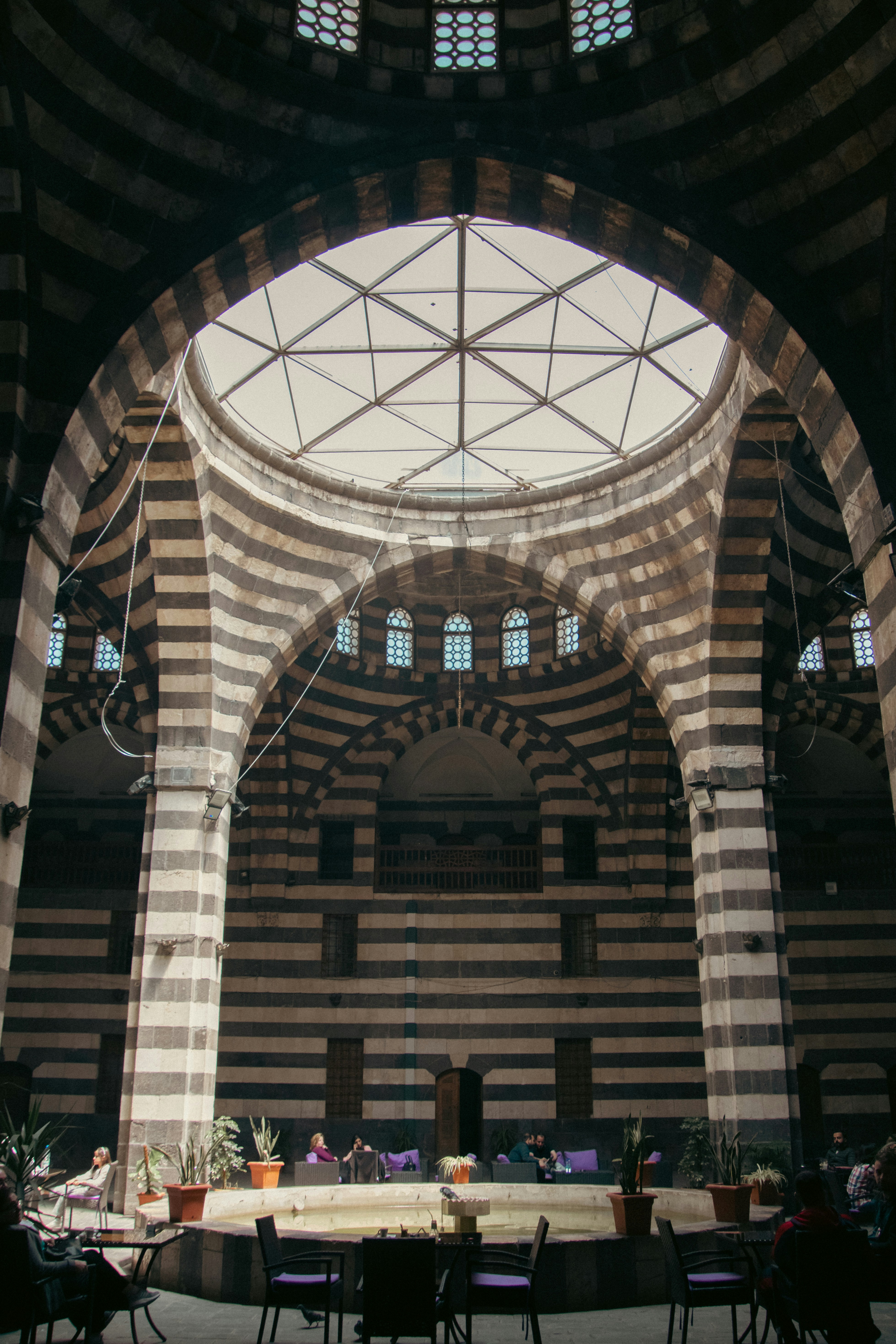 The inside of a large building with a circular ceiling