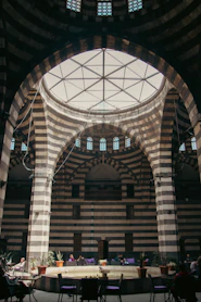 The inside of a large building with a circular ceiling