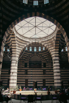 The inside of a large building with a circular ceiling