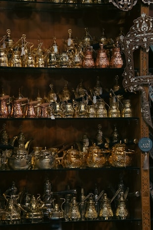 A shelf filled with lots of different types of pots and pans
