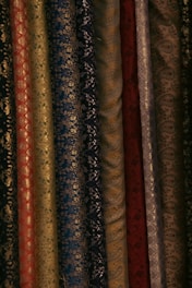 A close up of a bunch of different colored fabrics