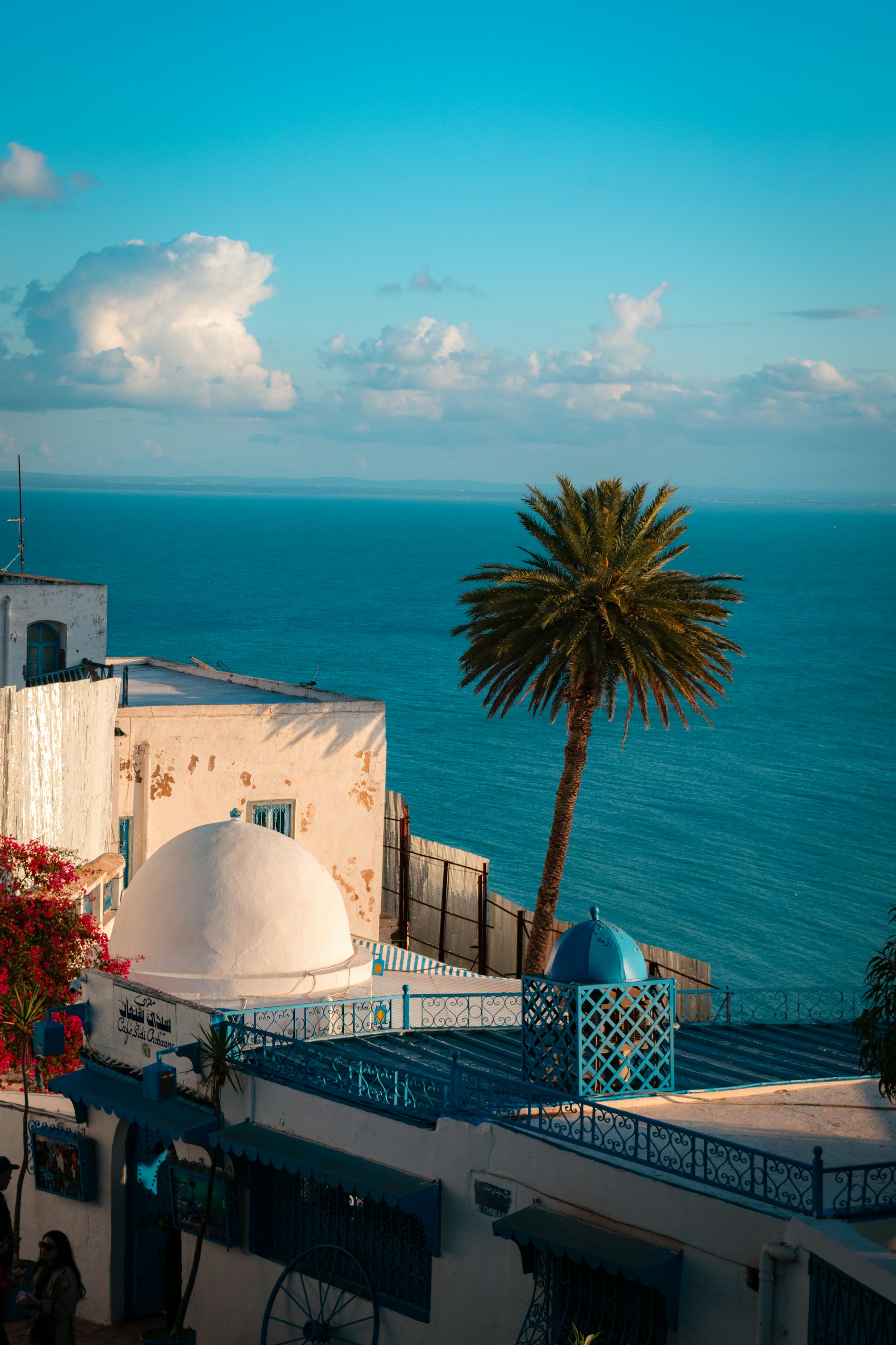 A view of the ocean from a rooftop of a building
