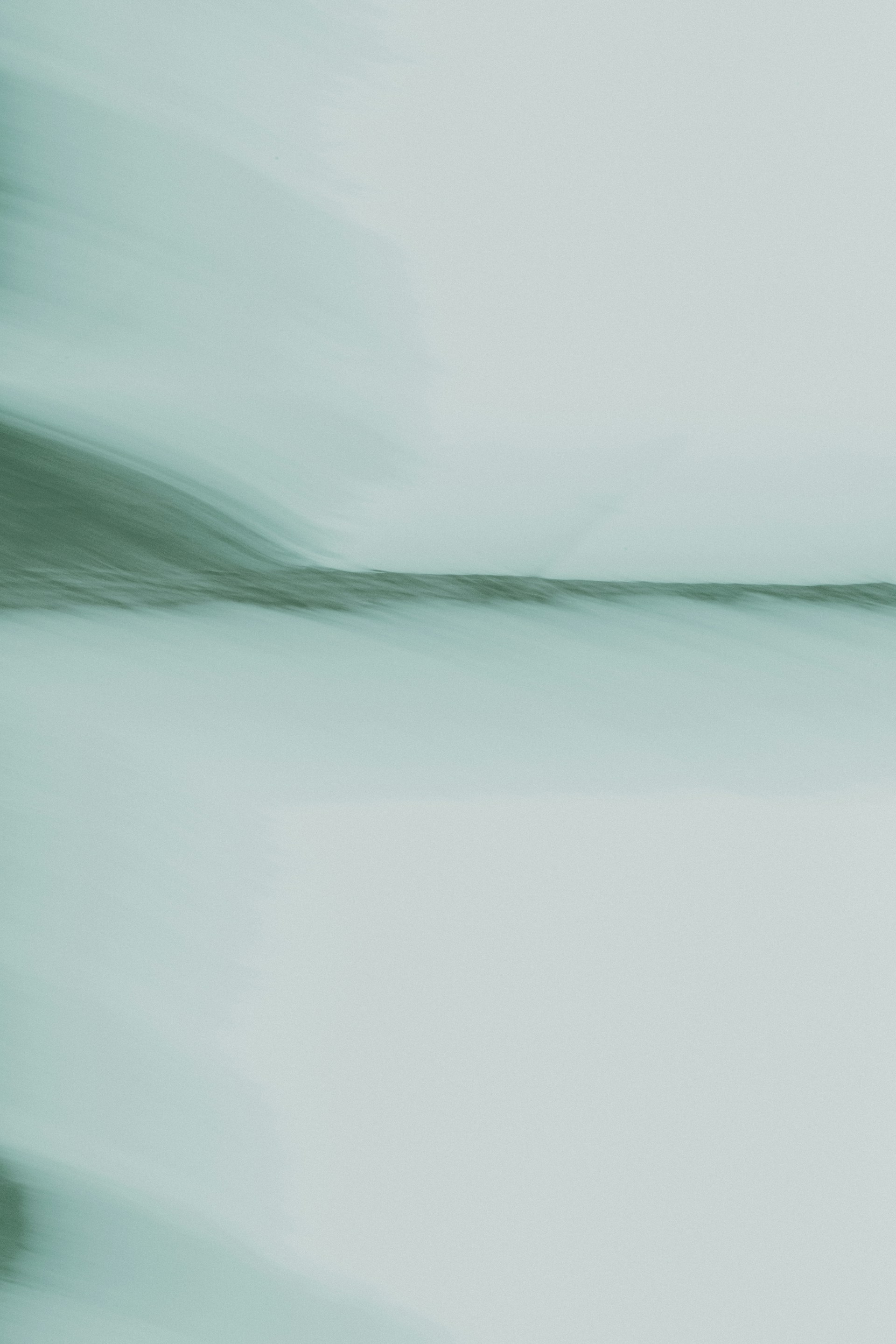 A blurry photo of a bird flying in the sky