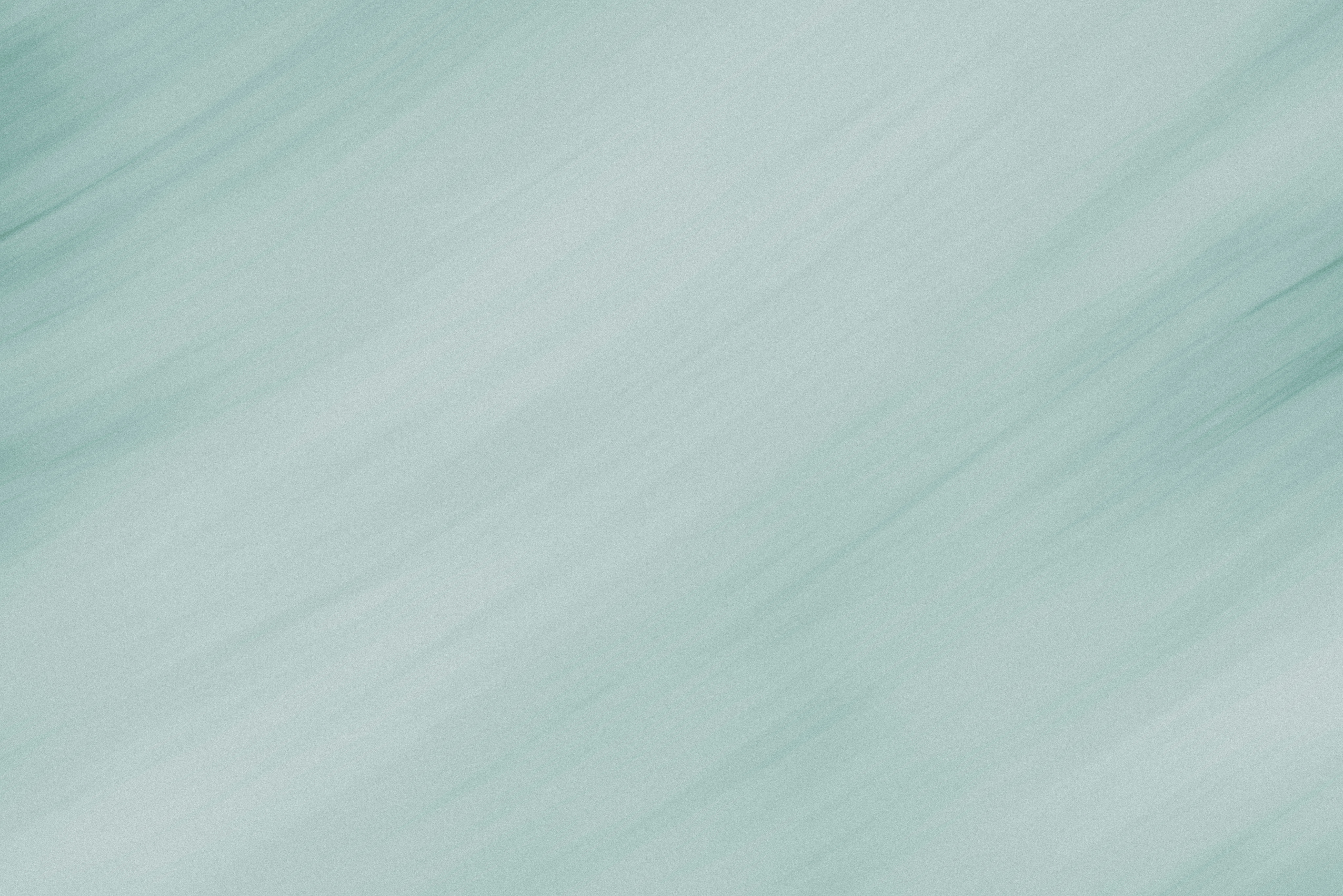 A blurry photo of a green and white background