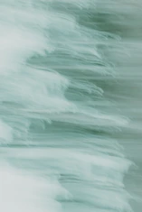 A blurry photo of a surfboard in the water