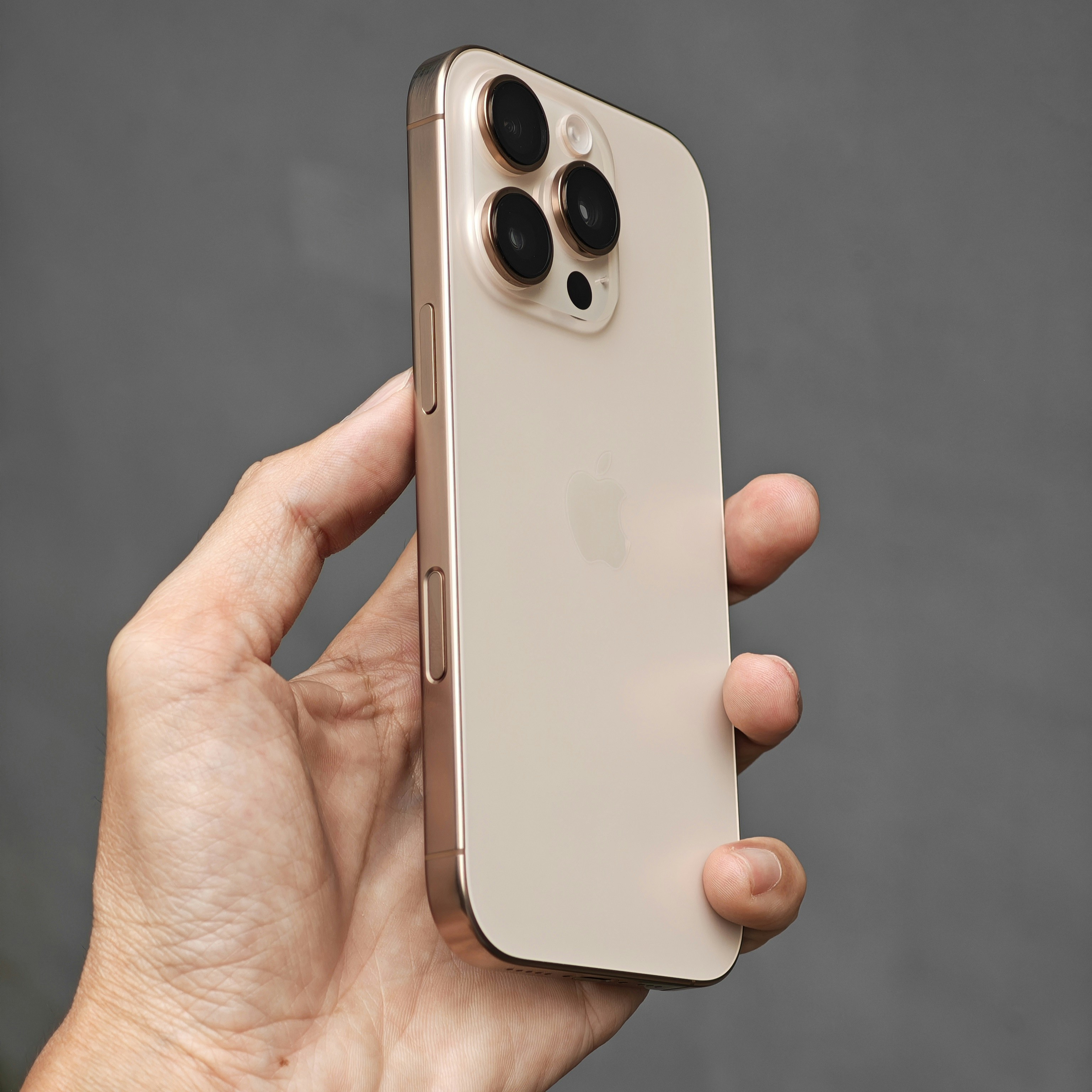 A person holding an iPhone in their hand