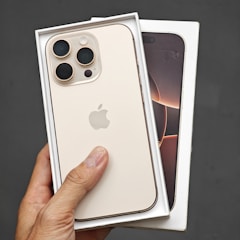 A person holding a white iPhone case in their hand