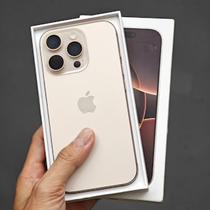 A person holding a white iPhone case in their hand