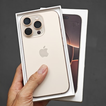 A person holding a white iPhone case in their hand