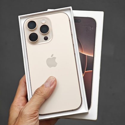 A person holding a white iPhone case in their hand