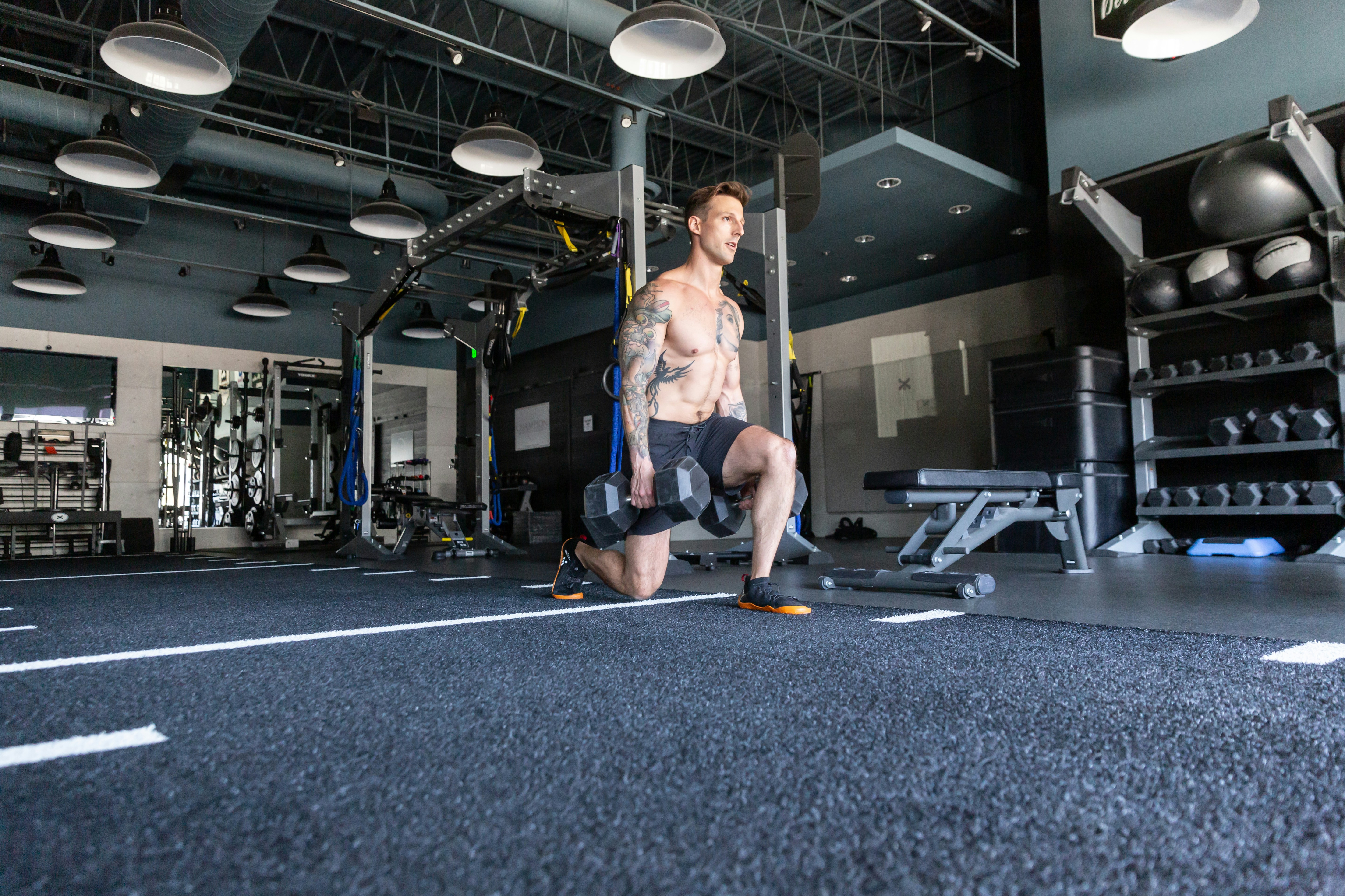 person performing goblet squat with dumbbell full-body strength workout