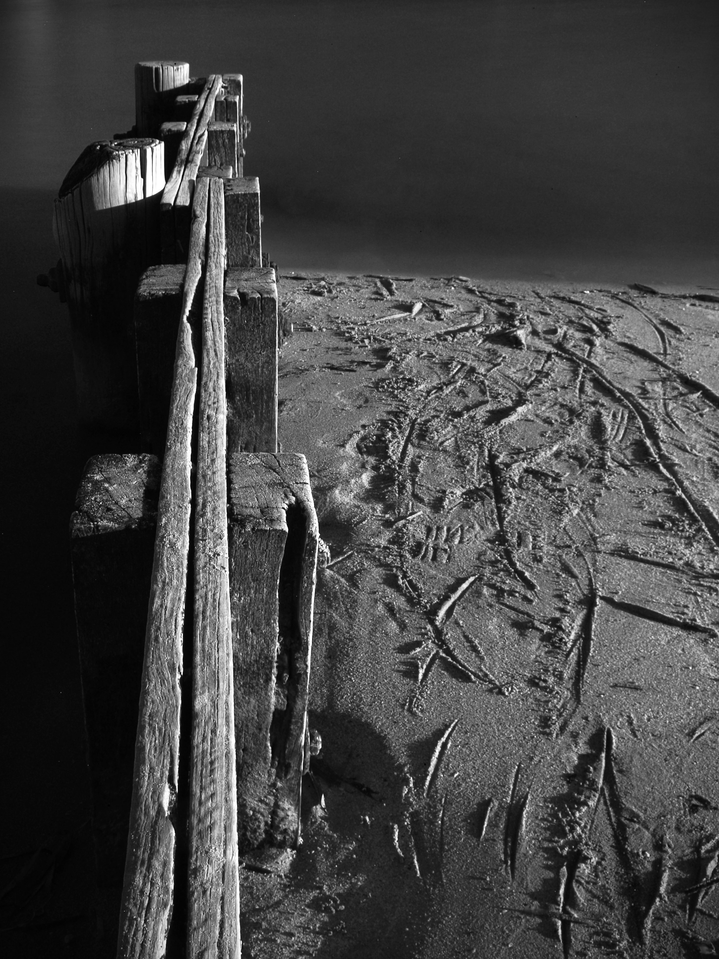 A black and white photo of a boat in the water