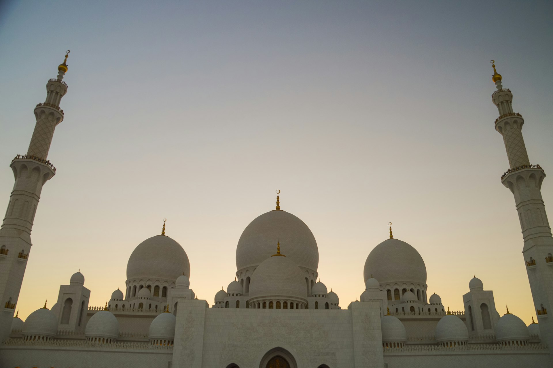 A large white building with two tall white towers