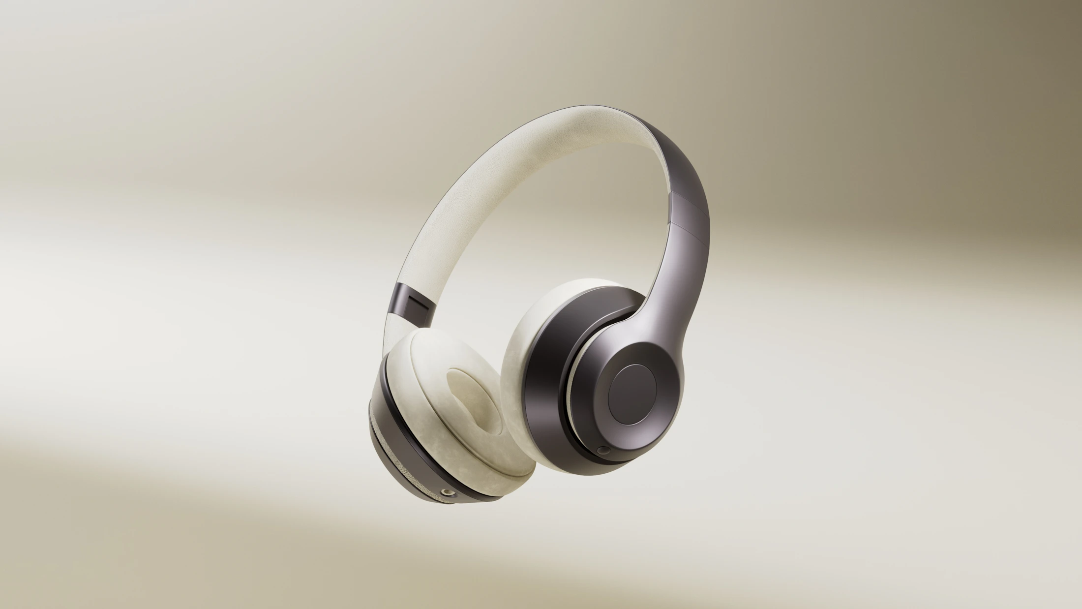 Cream over-ear headphones on a warm studio background