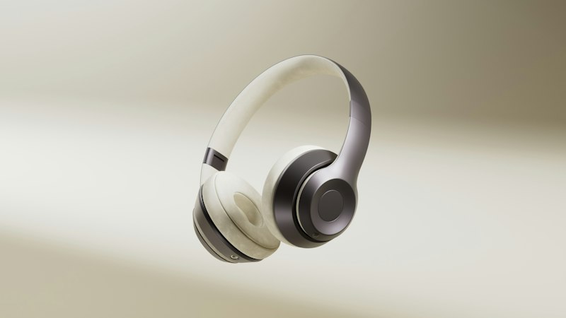 Premium over-ear wireless headphones with cushioned ear pads and a metallic grey frame