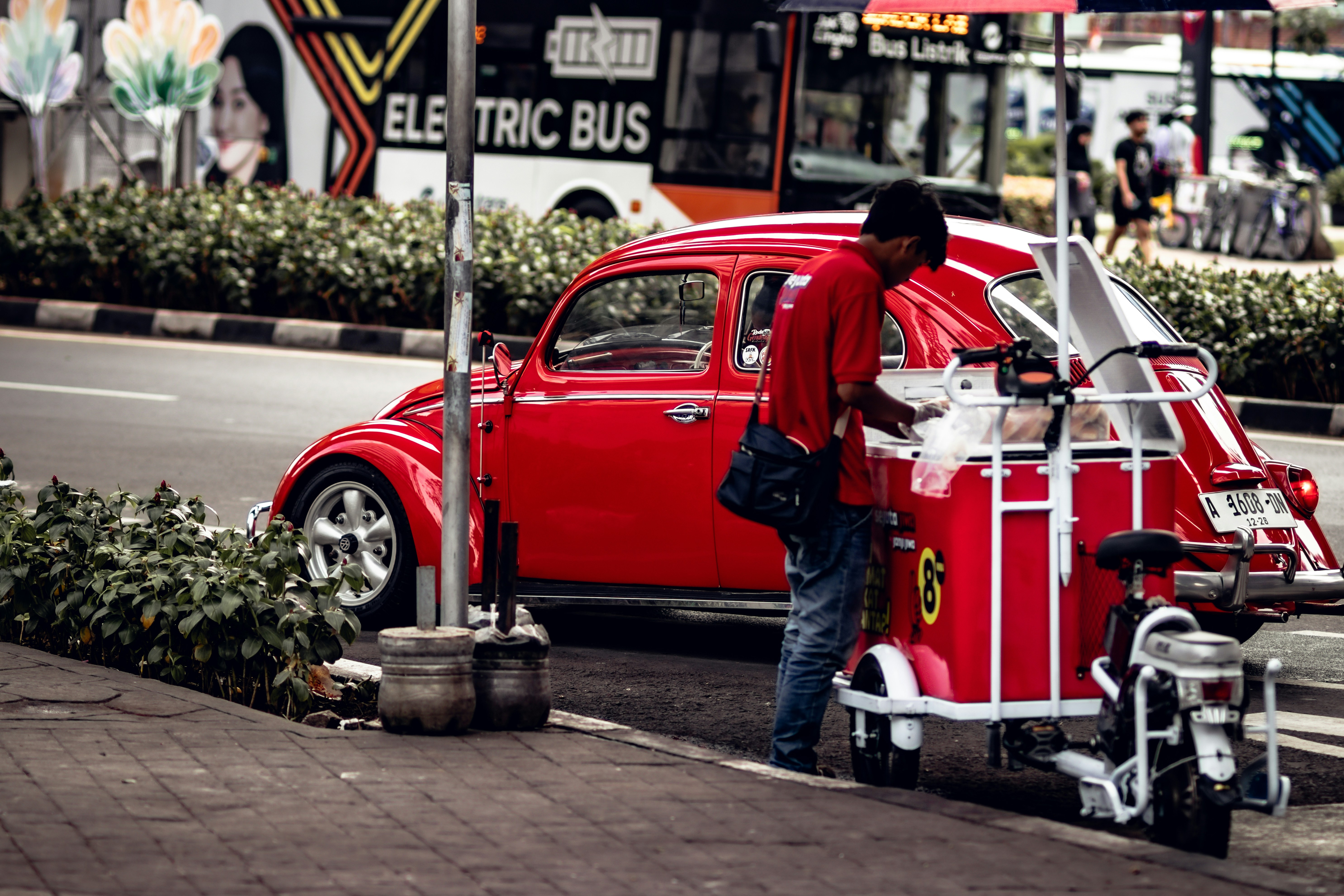 A red car parked on the side of the road