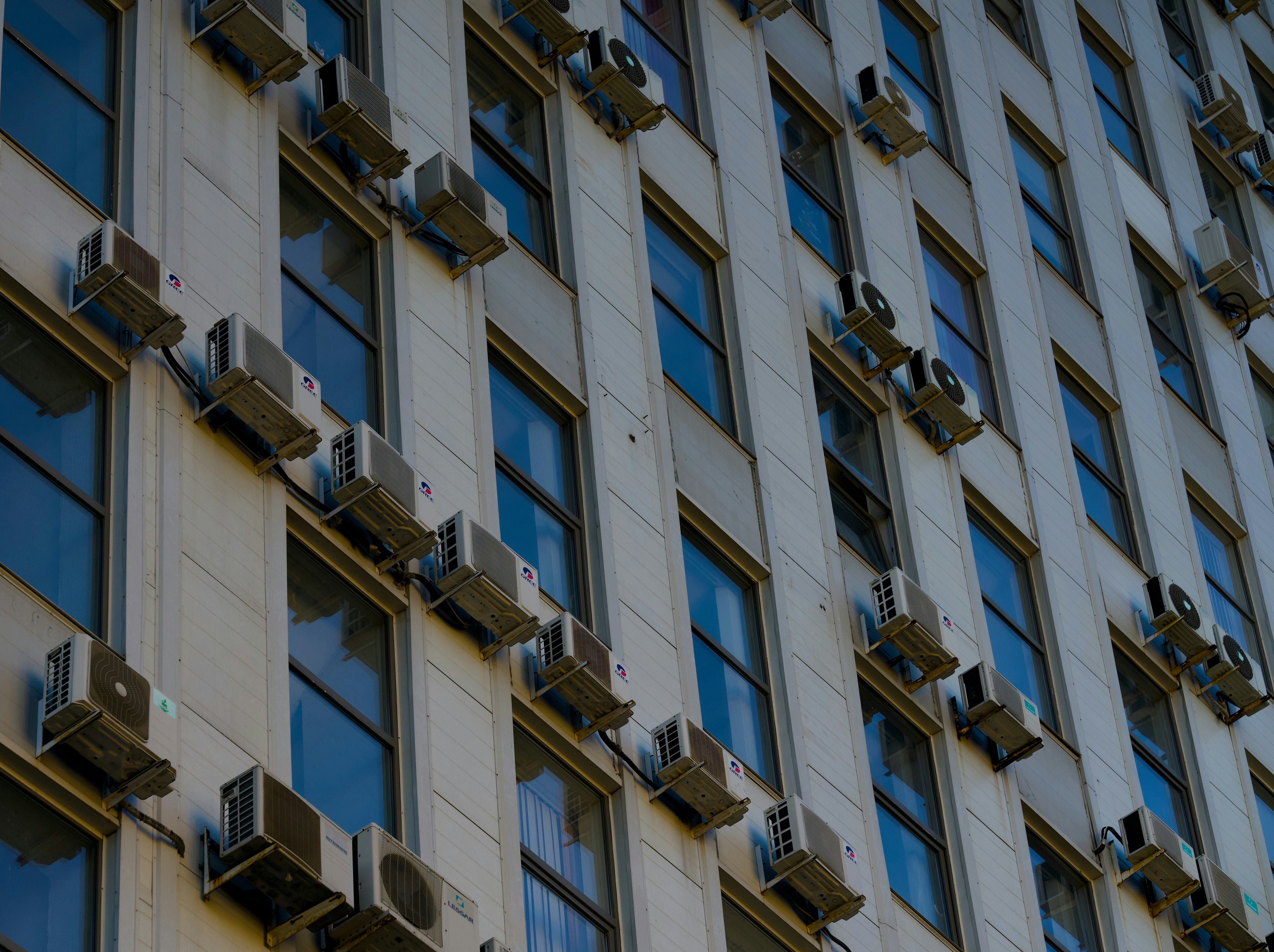 A tall building with lots of windows and a clock