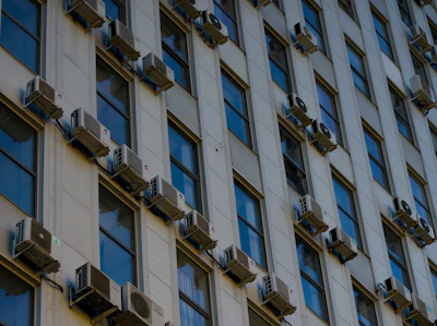 A tall building with lots of windows and a clock