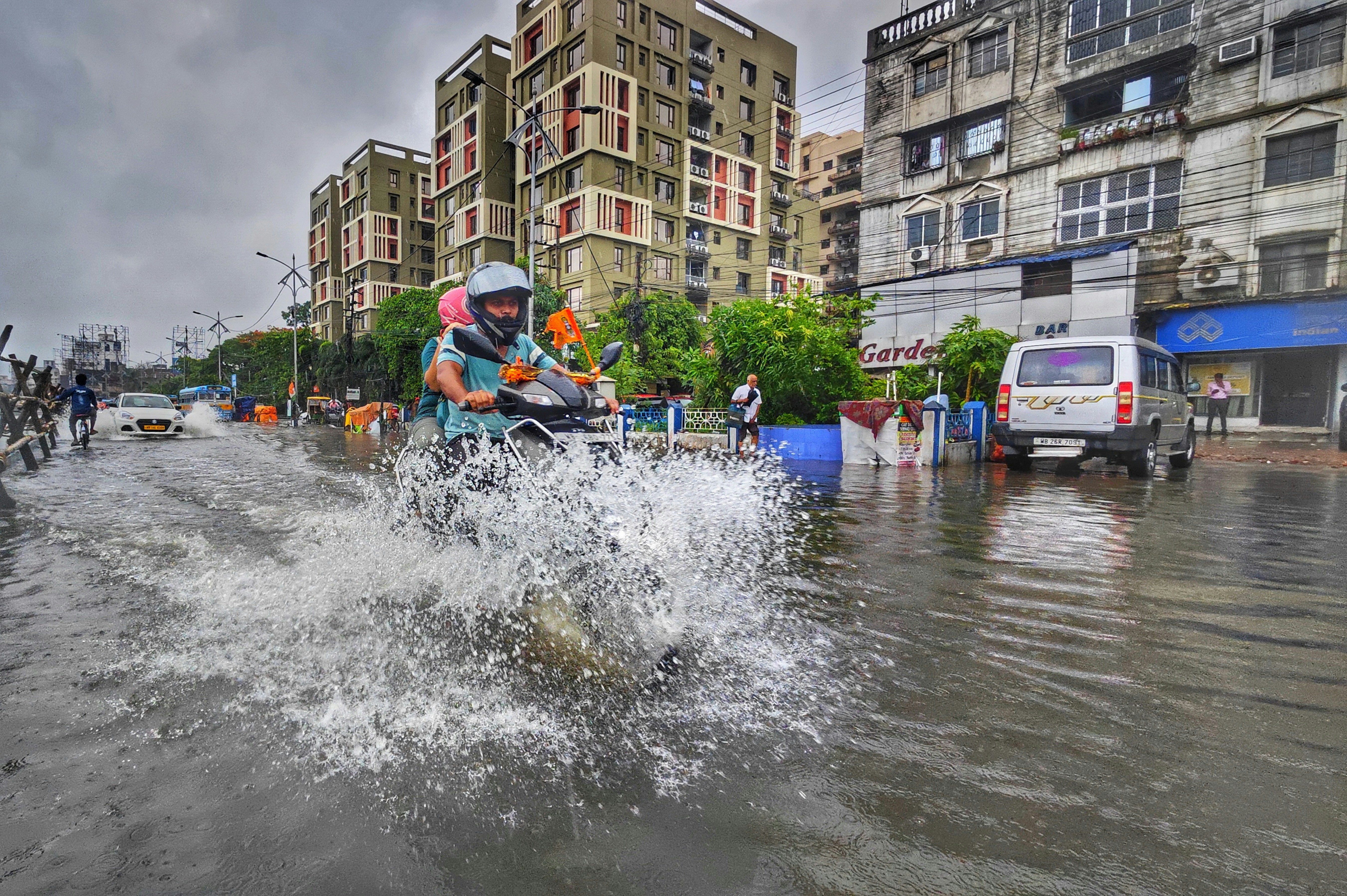 Man riding jet ski on flooded street