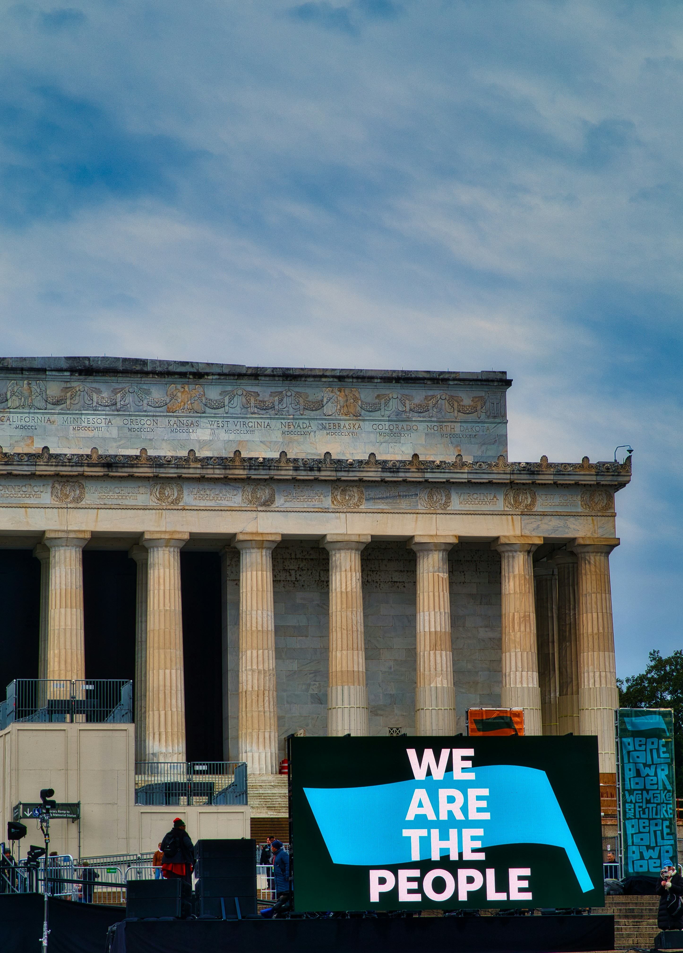 A group of people standing in front of a building