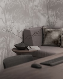 A living room with a couch and a table