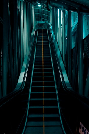 An escalator going up a hill in a building