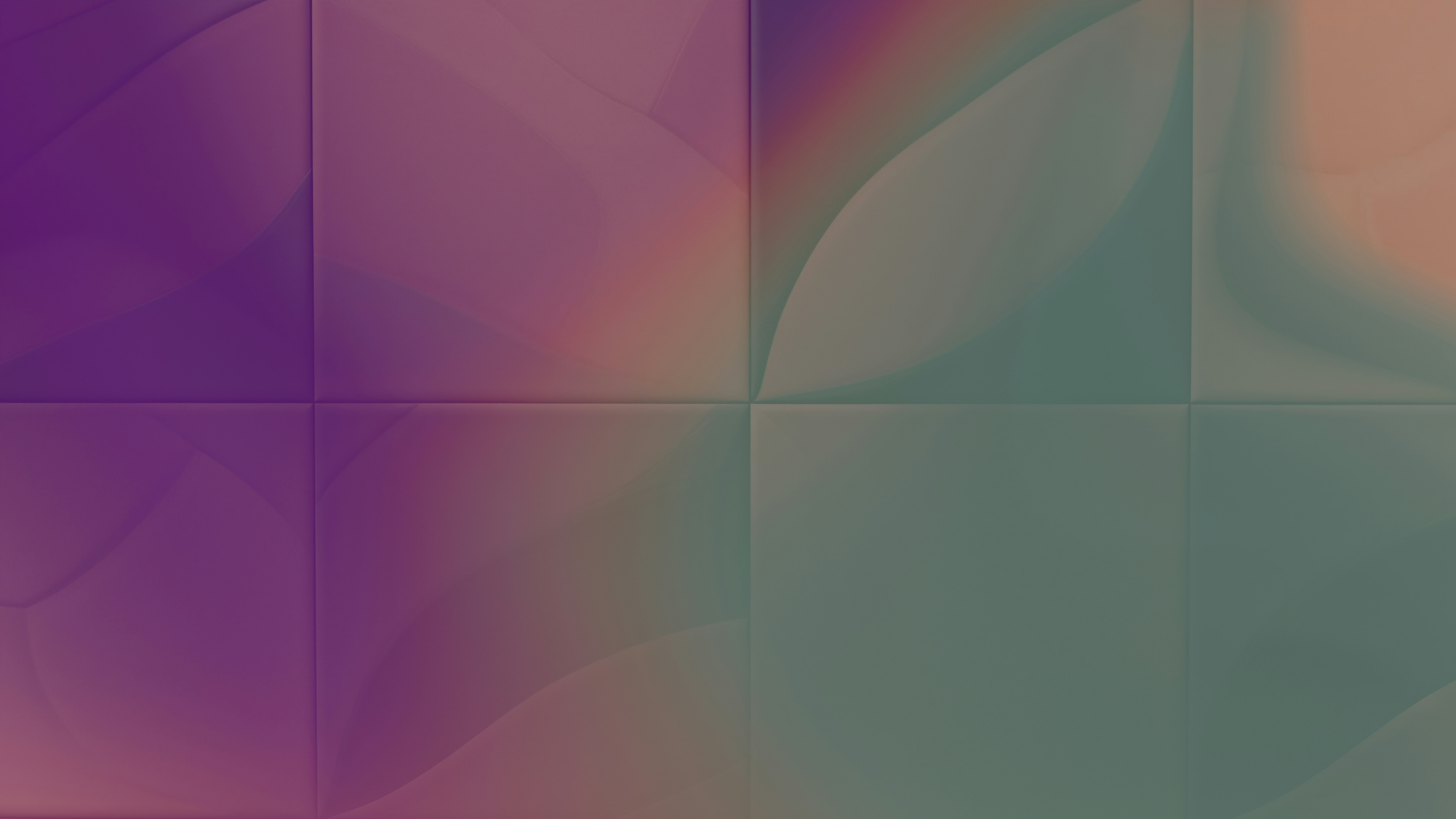A blurry image of a purple and green background