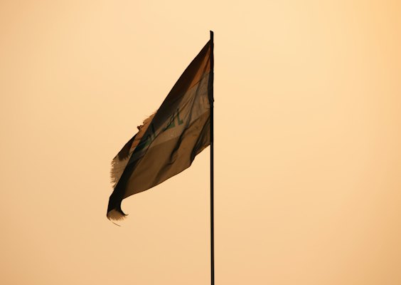A flag flying in the wind on a pole — Baghdad, Iraq