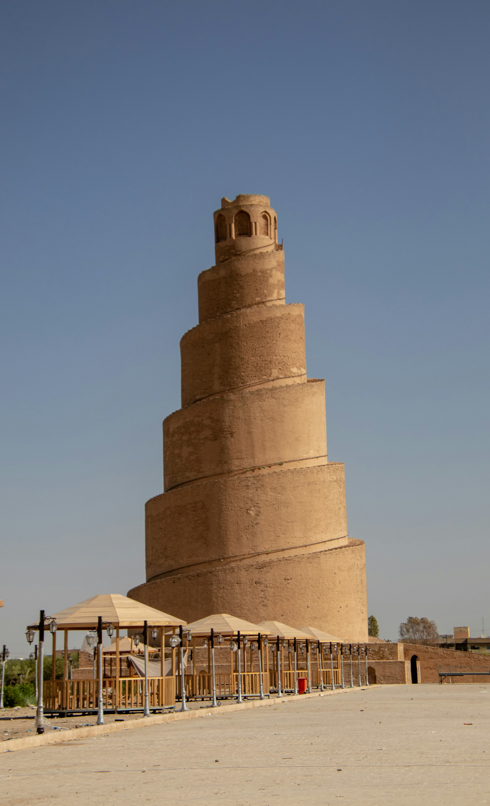 A very tall tower with a clock on it's side