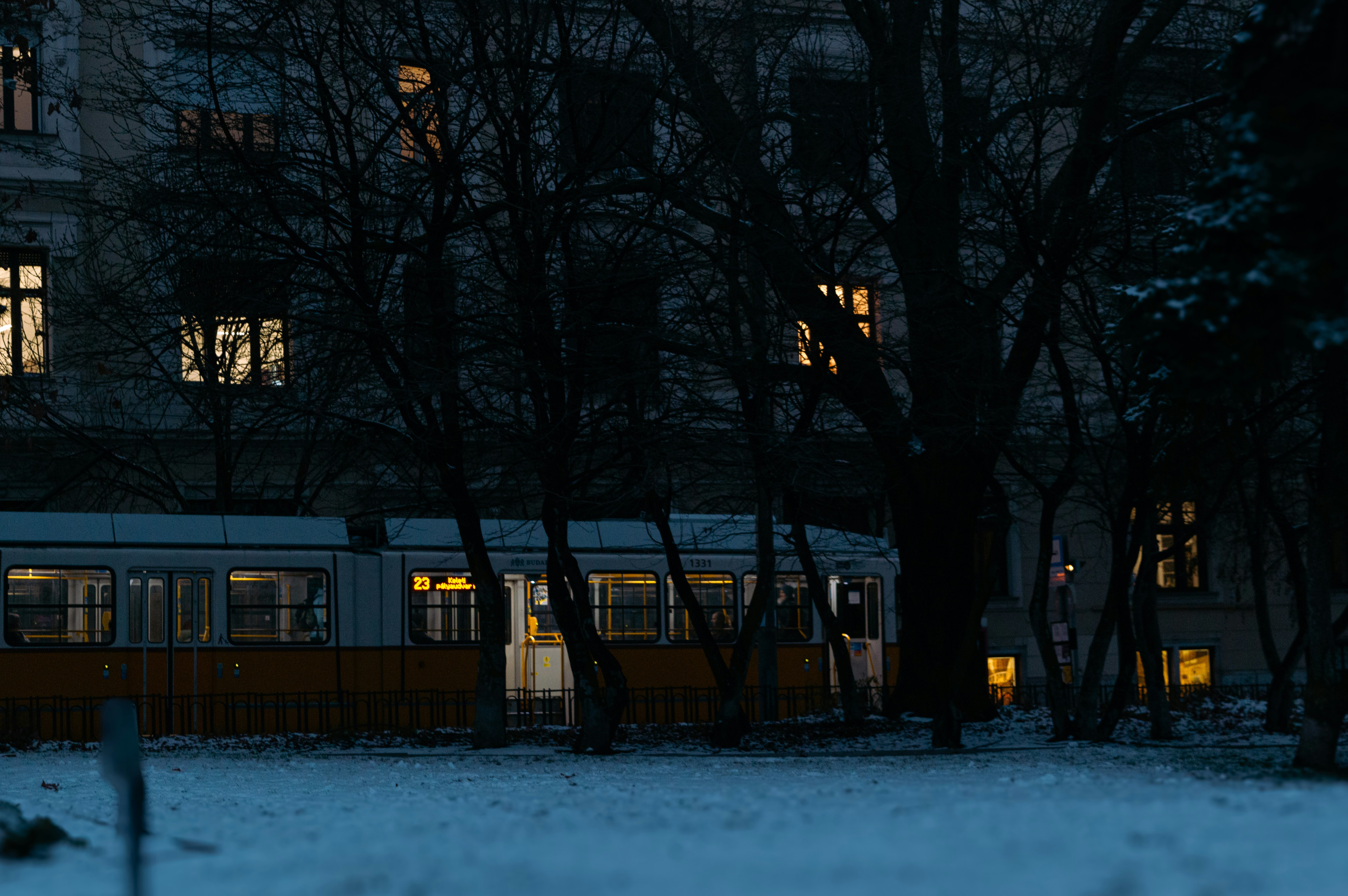 A building lit up at night in the snow