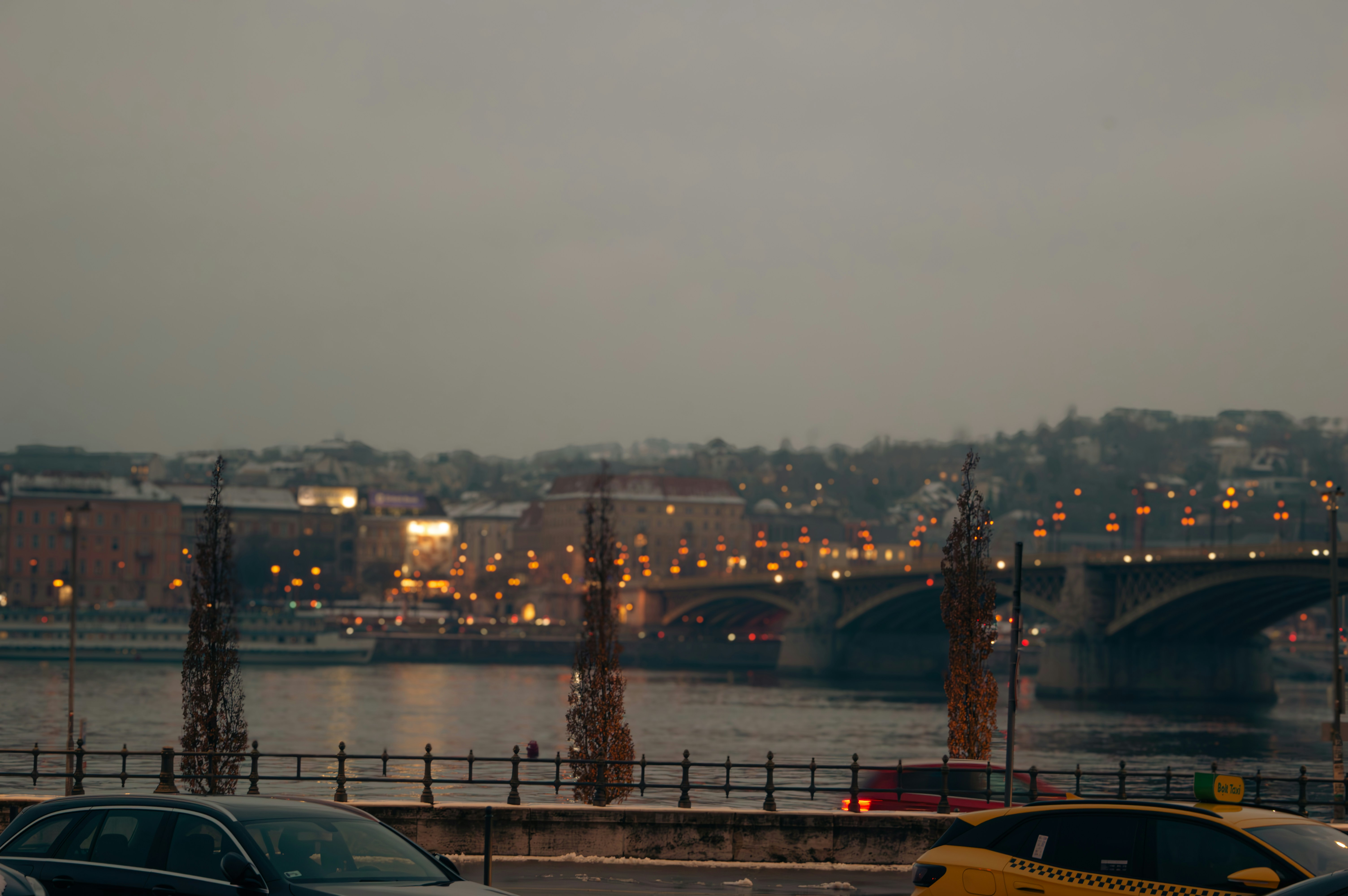 A group of cars parked next to each other in a parking lot
