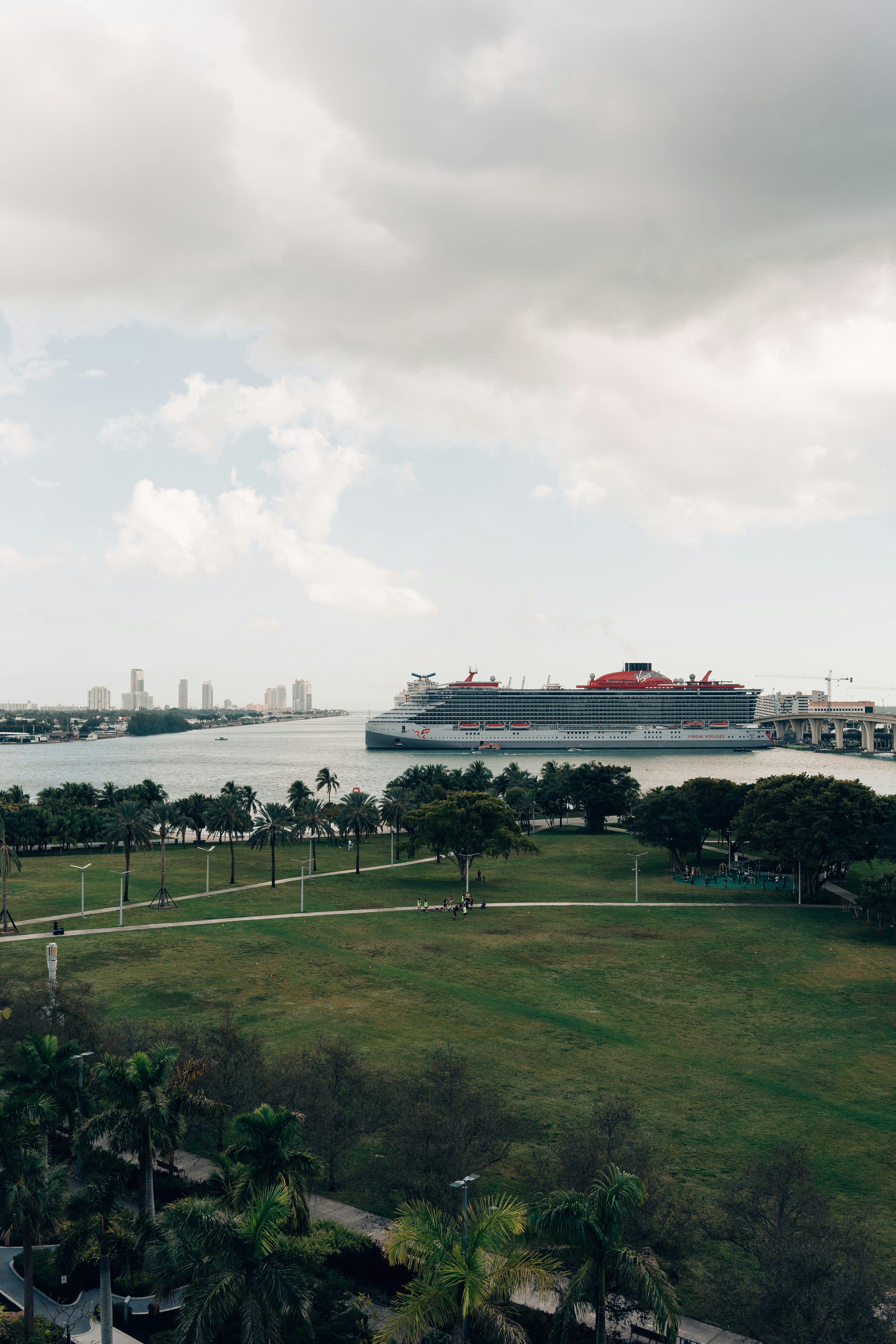 A cruise ship is in the distance on the water