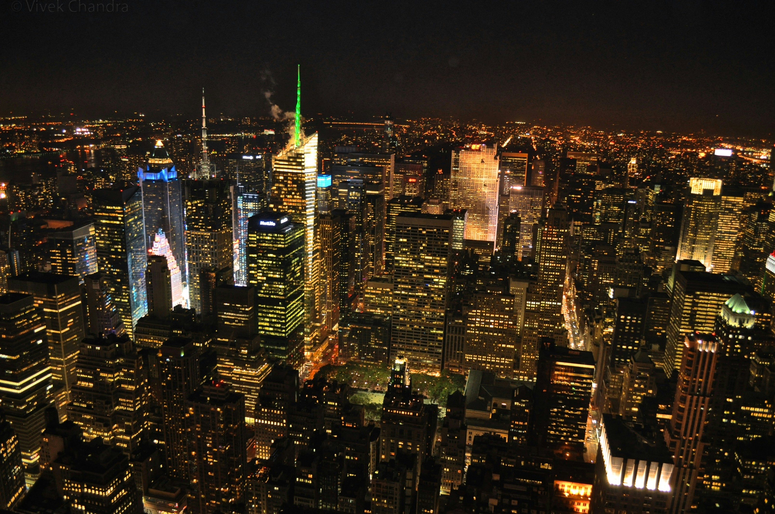 A view of a city at night from the top of a building