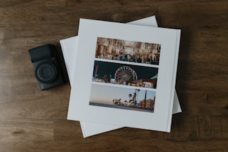A couple of photos sitting on top of a wooden table