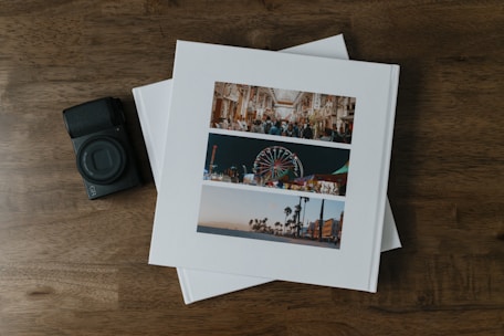 A couple of photos sitting on top of a wooden table