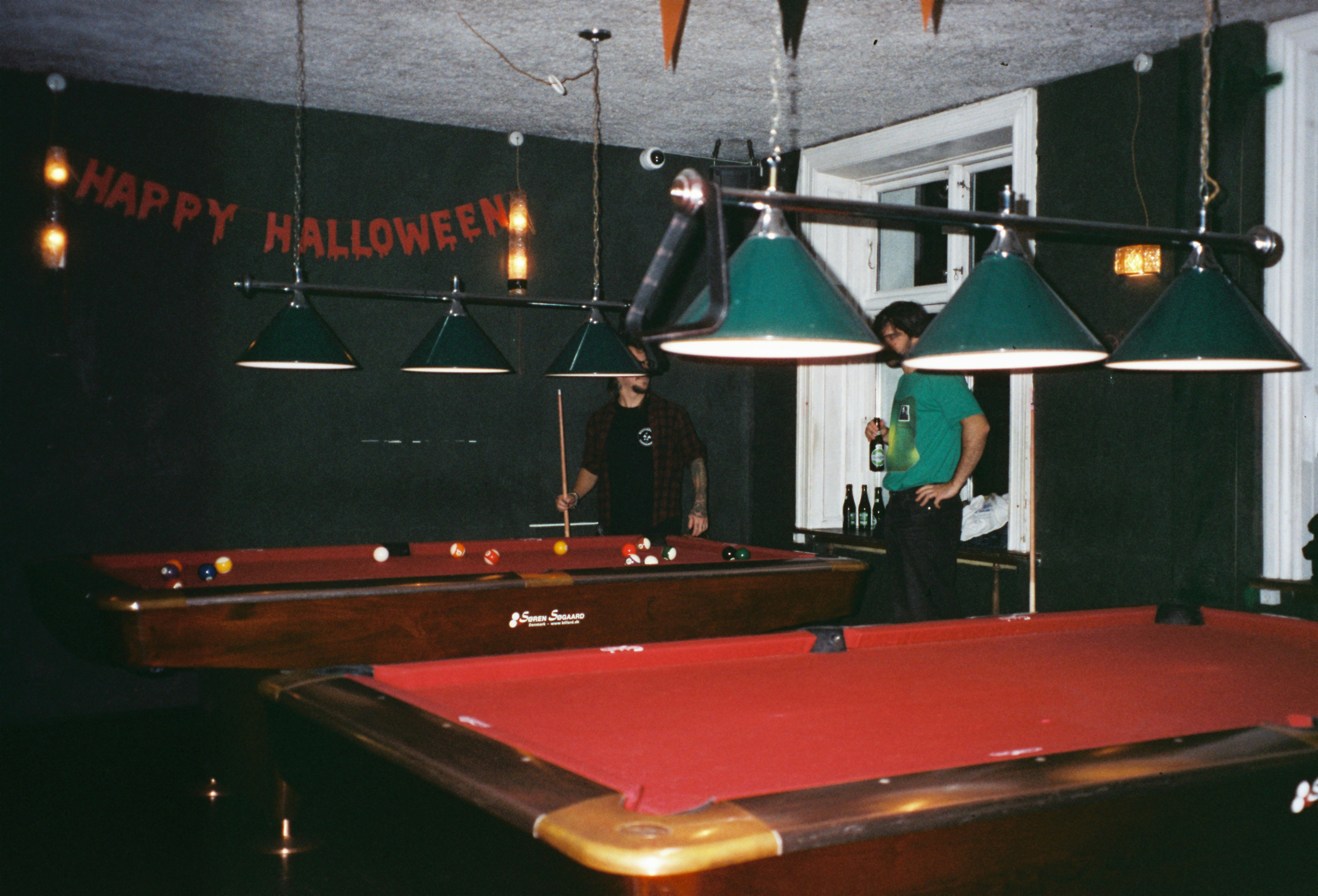 A pool table with a red cloth on it