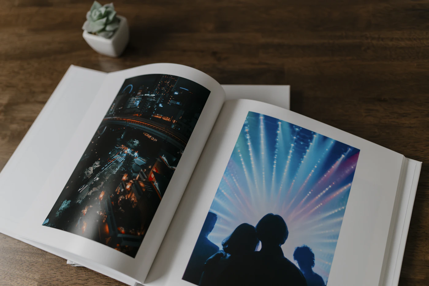 Open wedding photo album displayed on a table showing a couple photograph across a full spread