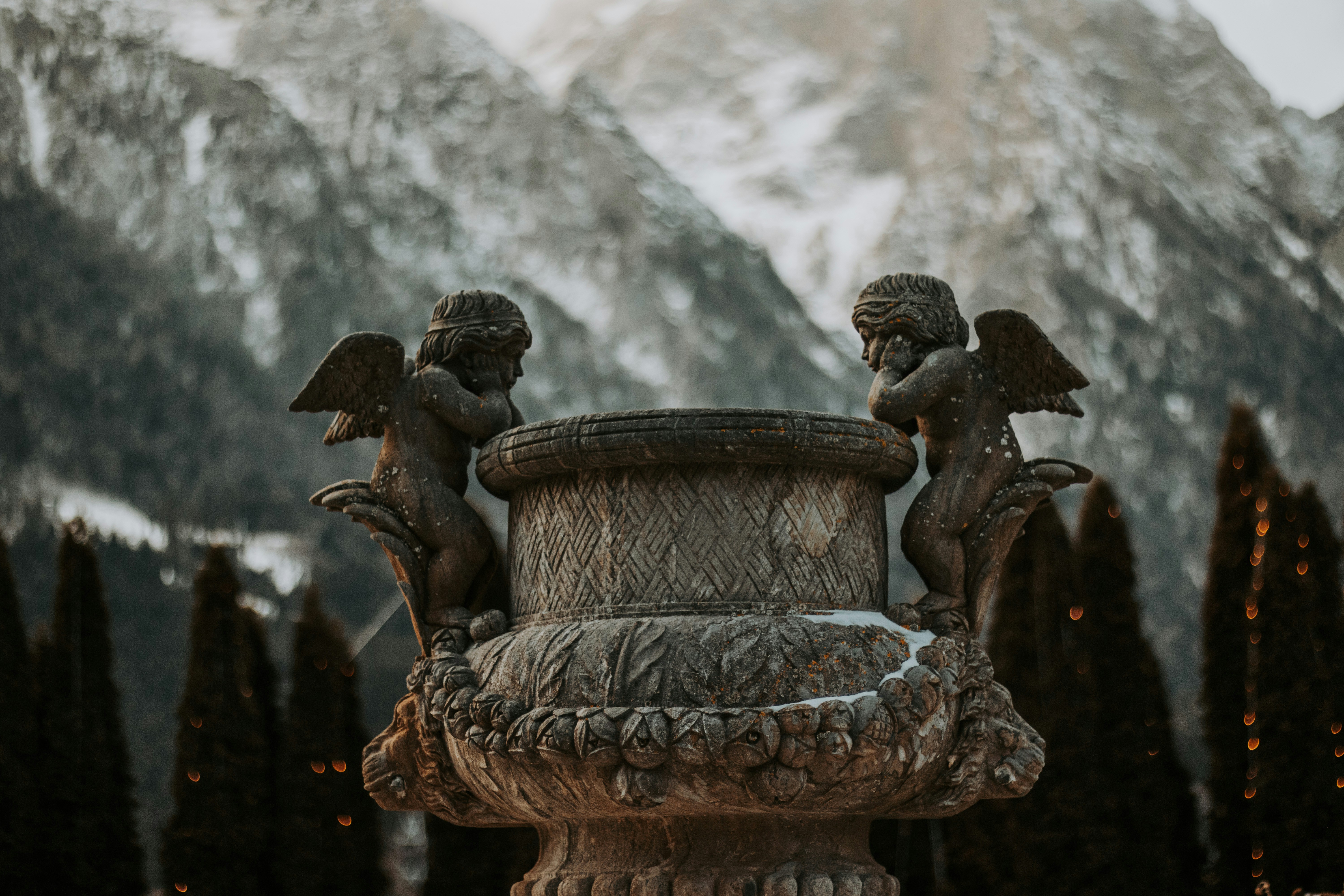 A statue of two cherubs on top of a fountain