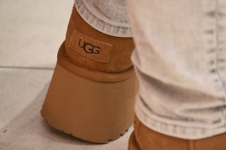 A close up of a person wearing a pair of boots