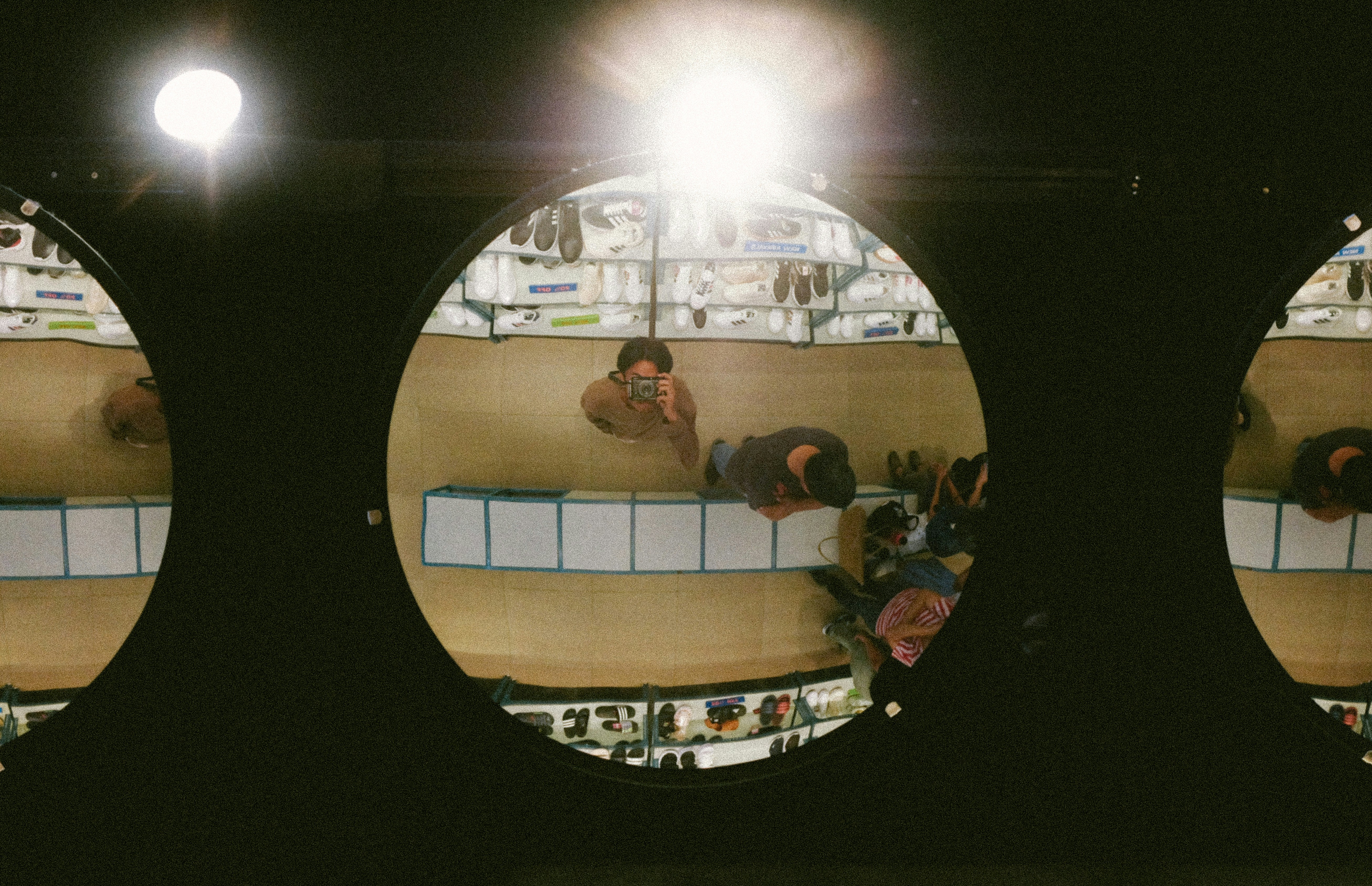 A group of people standing on top of a wooden floor