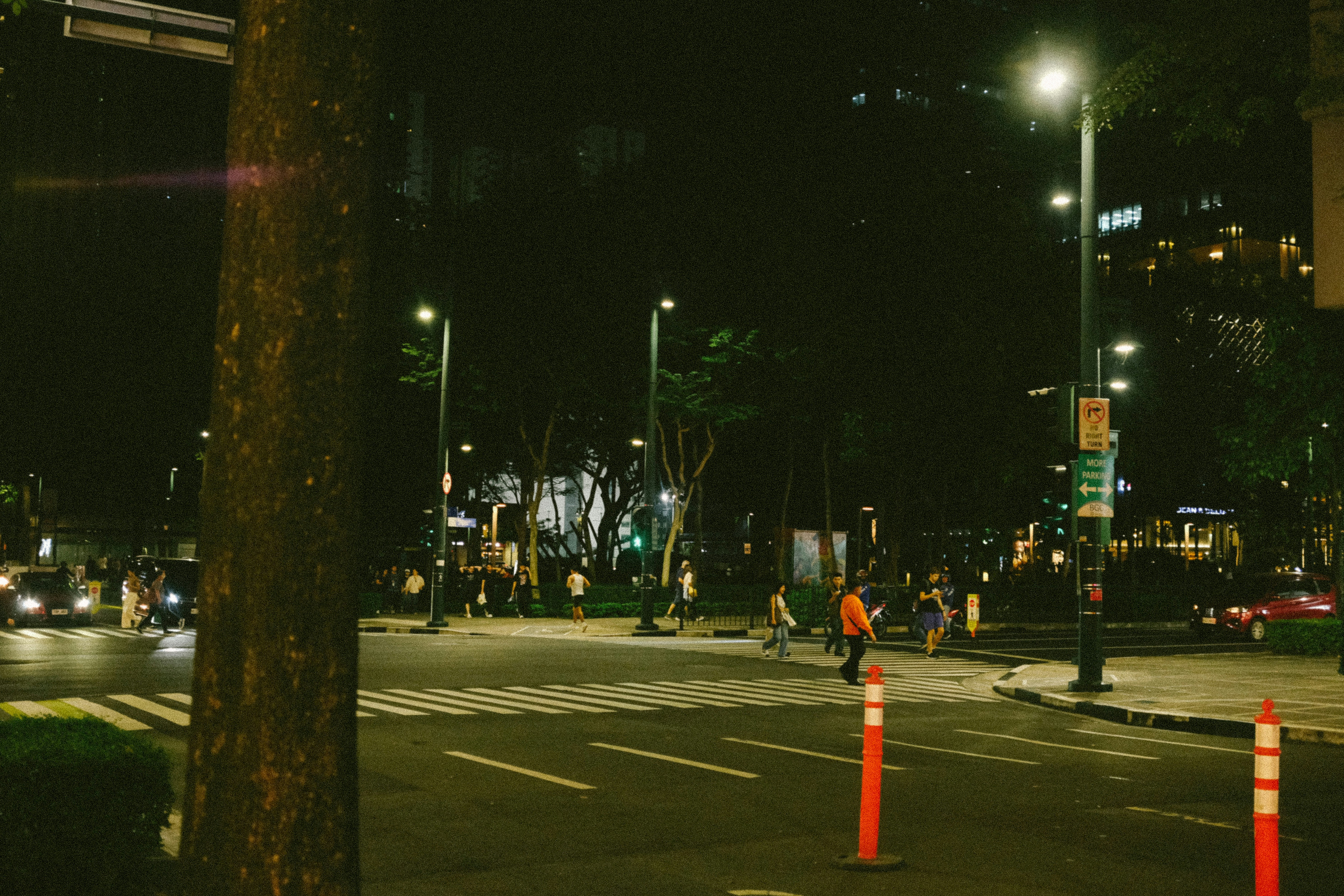 A city street at night with traffic lights