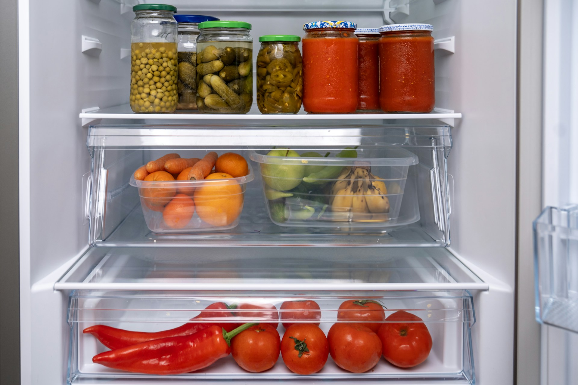 A refrigerator filled with lots of different types of food