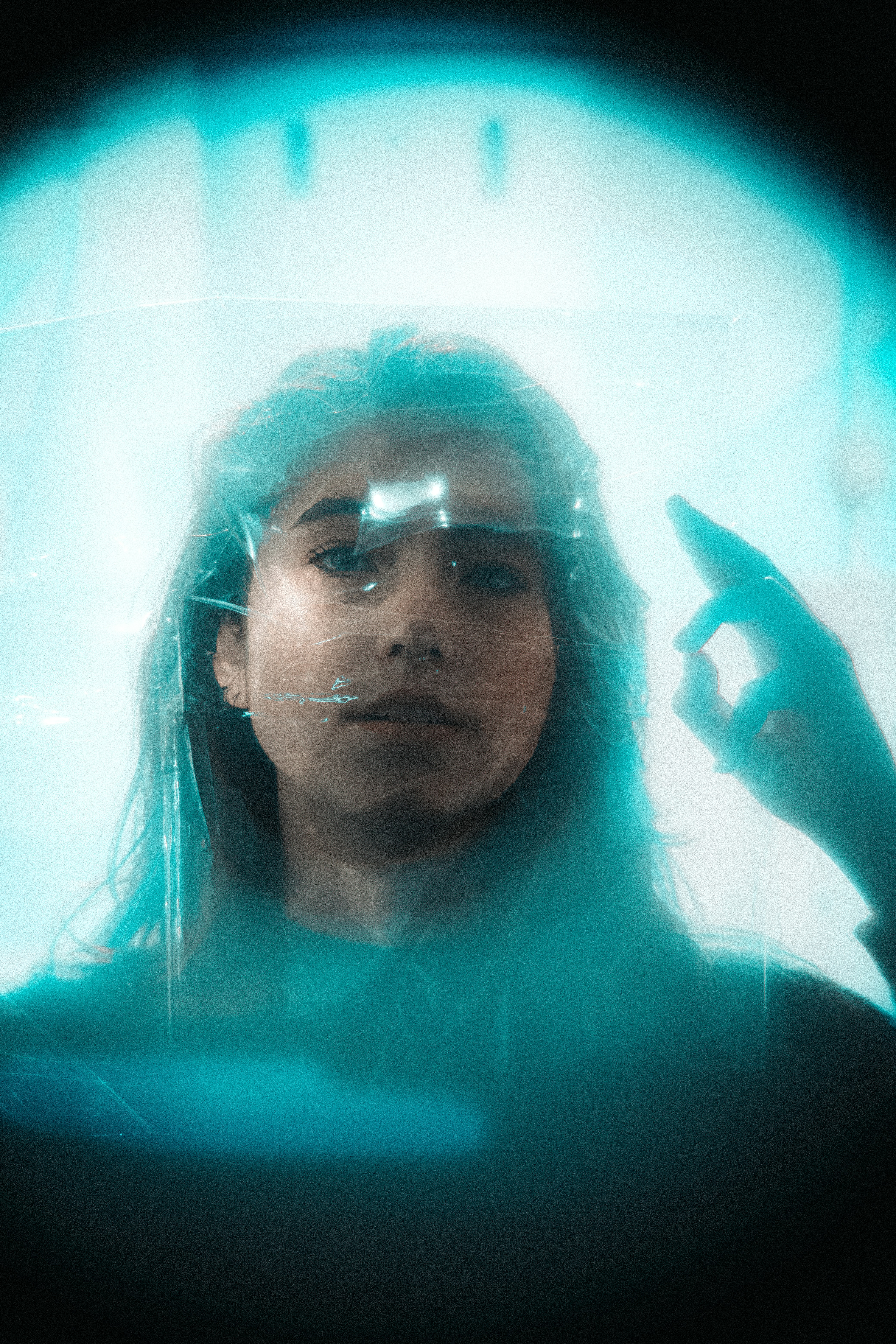 A woman holding a cell phone up to her face