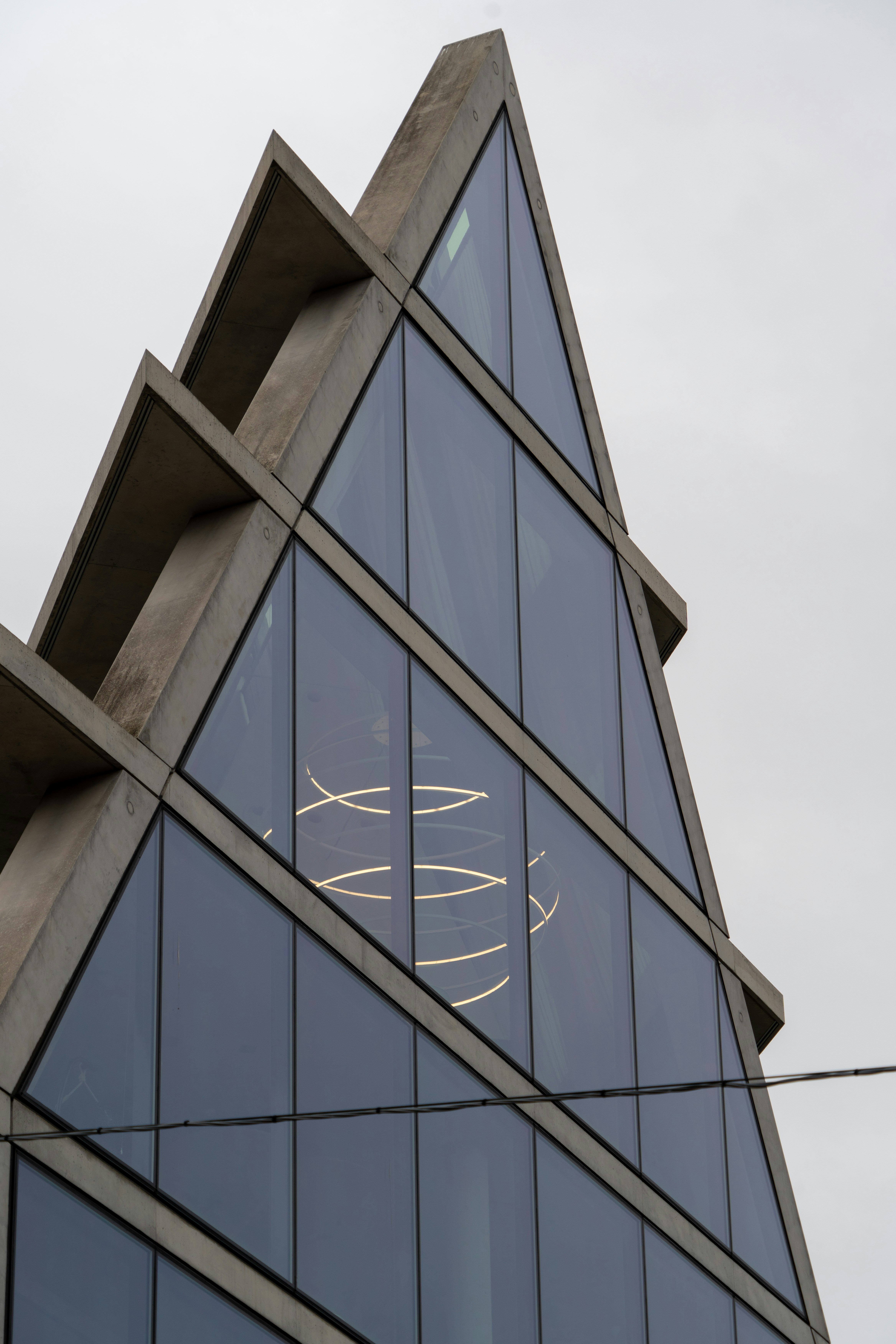 A very tall building with a clock on it's side