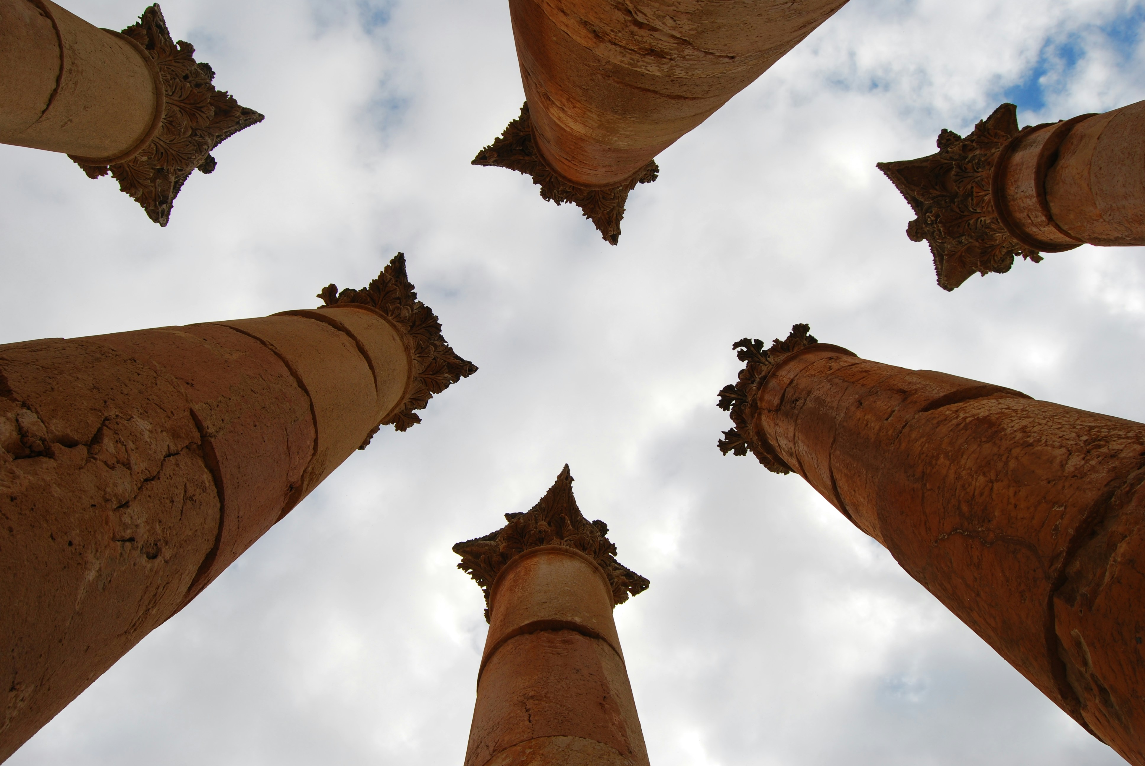 A group of tall brown pillars standing next to each other