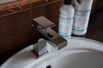 A close up of a sink with a soap dispenser