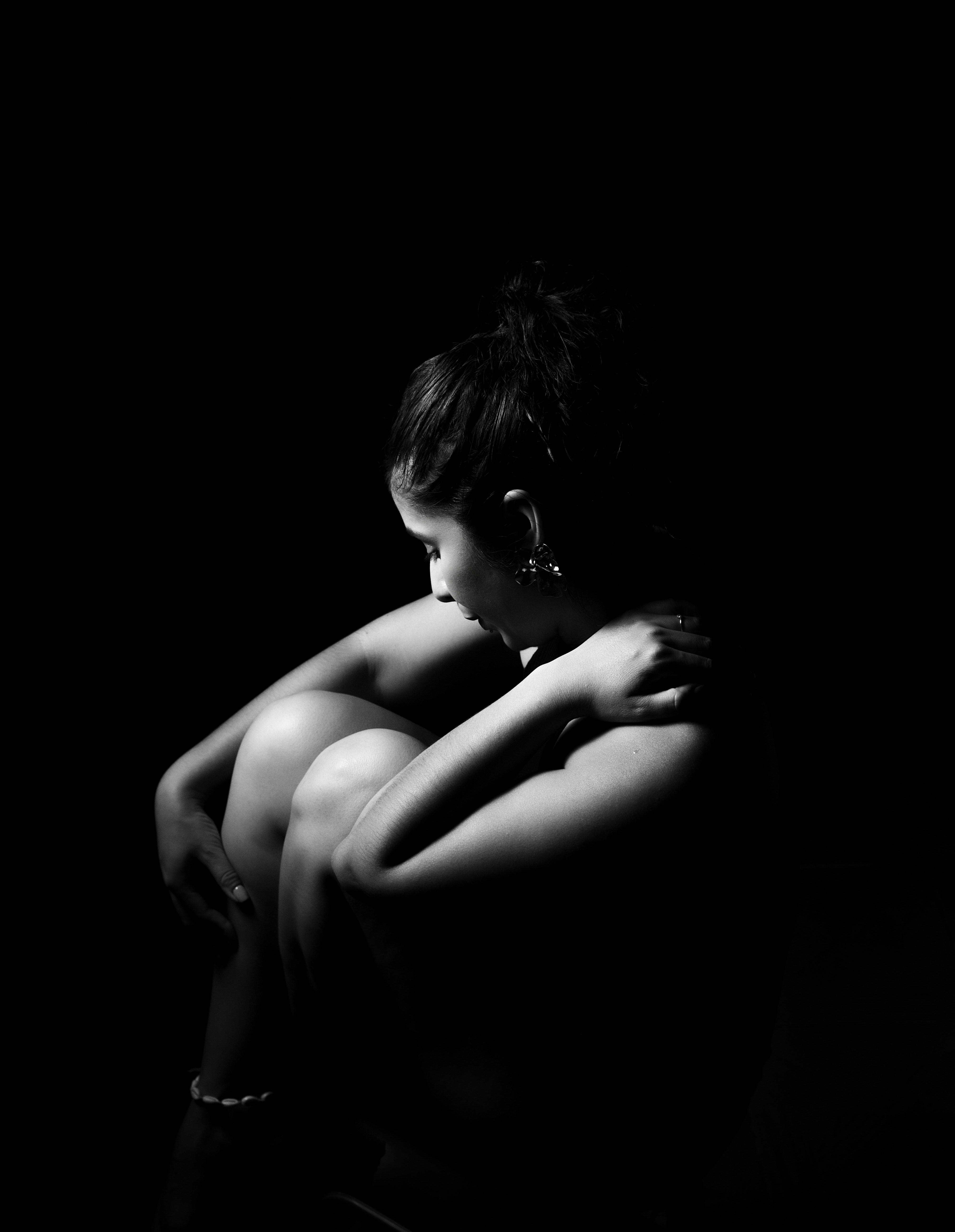 A black and white photo of a naked woman